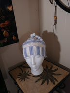 White and light blue crochet Adult Hat with sewn-together small pompoms