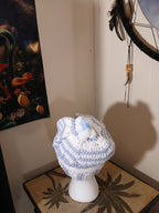 White and light blue crochet Adult Hat with sewn-together small pompoms