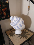 White and light blue crochet Adult Hat with sewn-together small pompoms