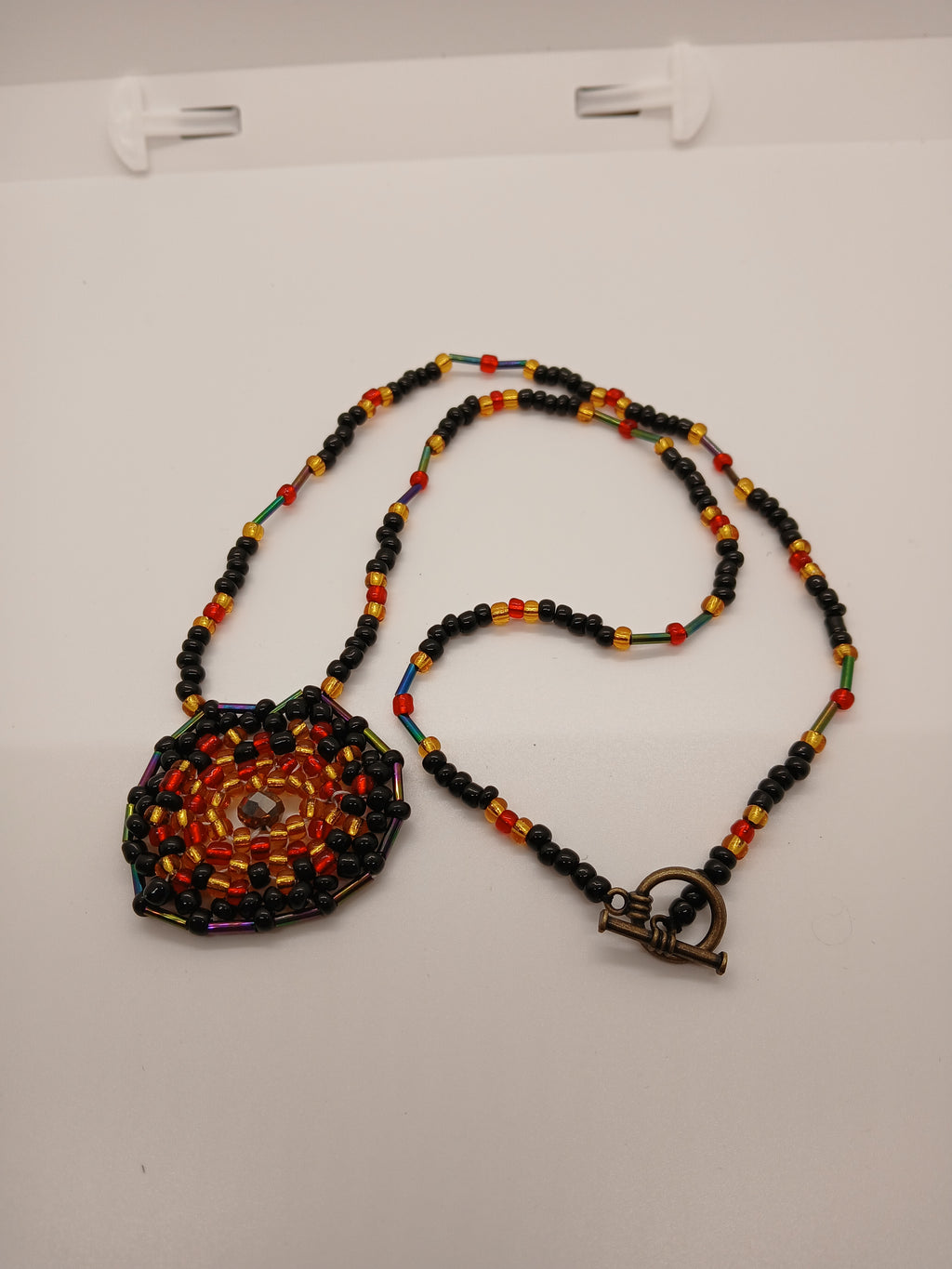 Ambers in the ash beaded pendant necklace by Oma Regina