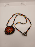 Ambers in the ash beaded pendant necklace by Oma Regina