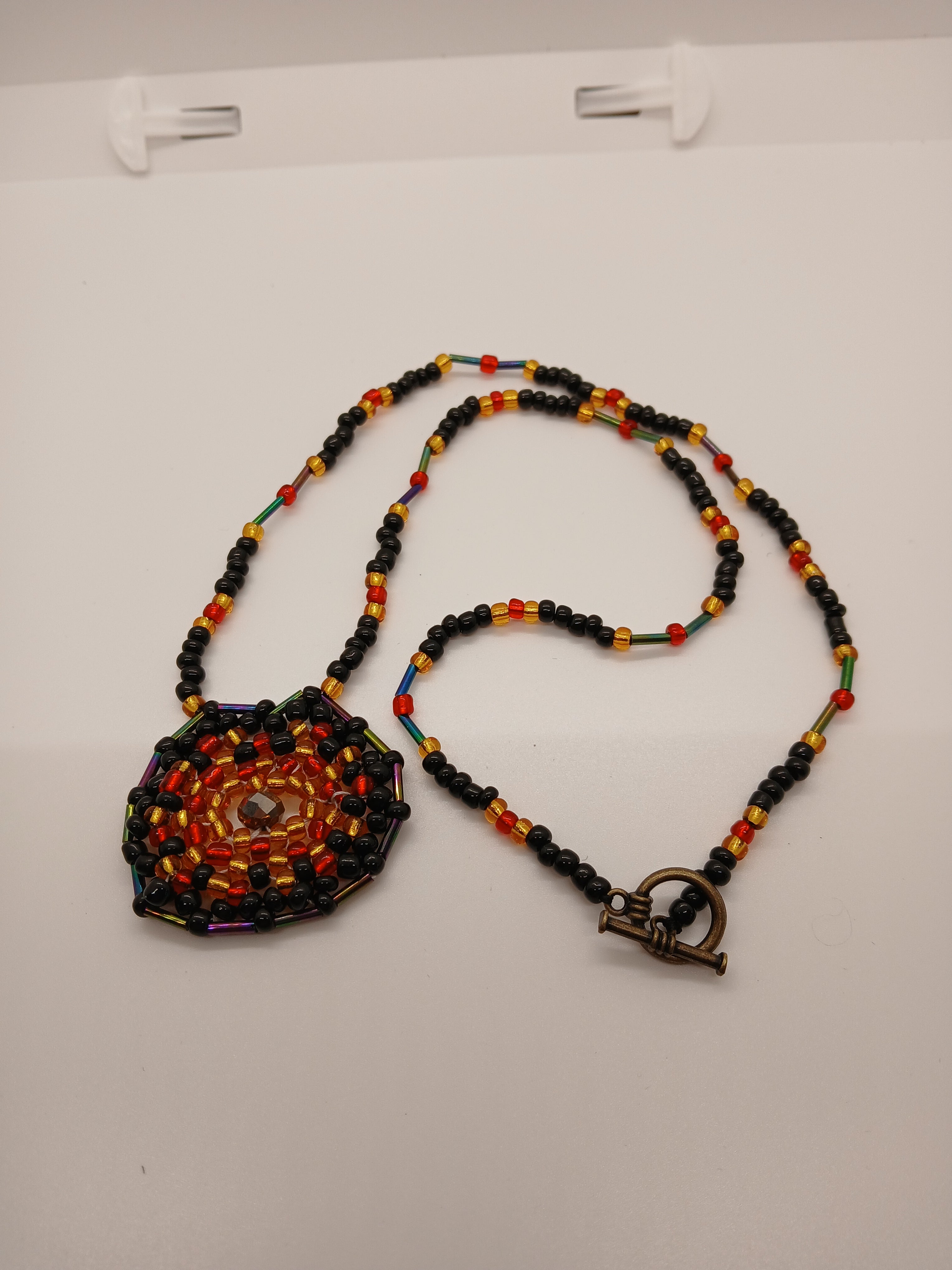 Ambers in the ash beaded pendant necklace by Oma Regina