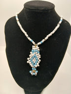 Light blue and white beaded pendant necklace with magnetic clasp  by Oma Regina