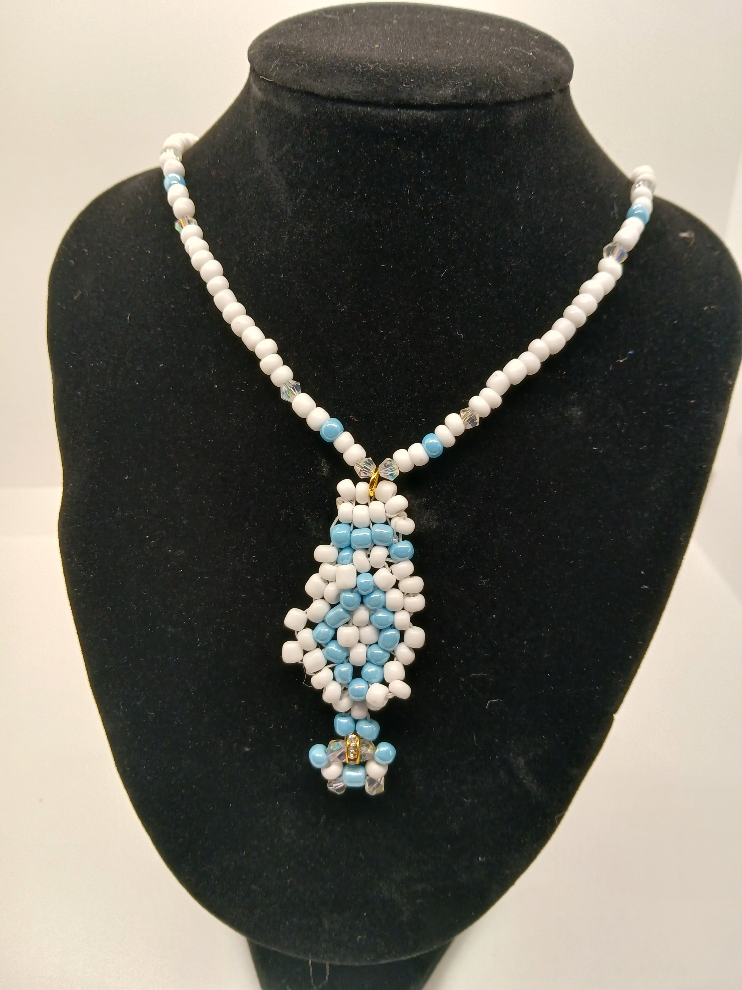 Light blue and white beaded pendant necklace with magnetic clasp  by Oma Regina