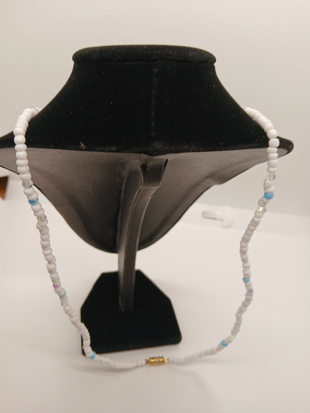 Light blue and white beaded pendant necklace with magnetic clasp  by Oma Regina