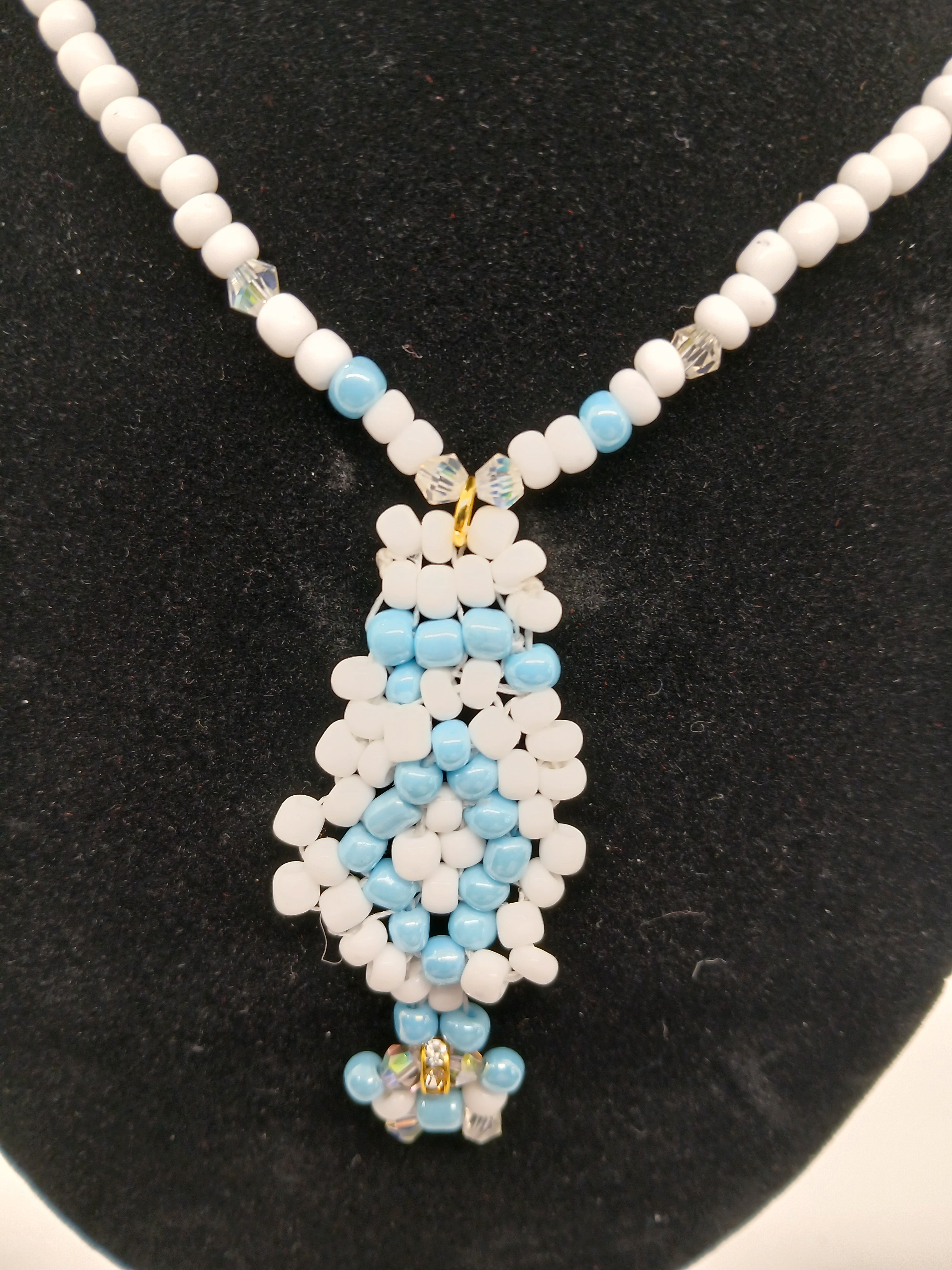 Light blue and white beaded pendant necklace with magnetic clasp  by Oma Regina