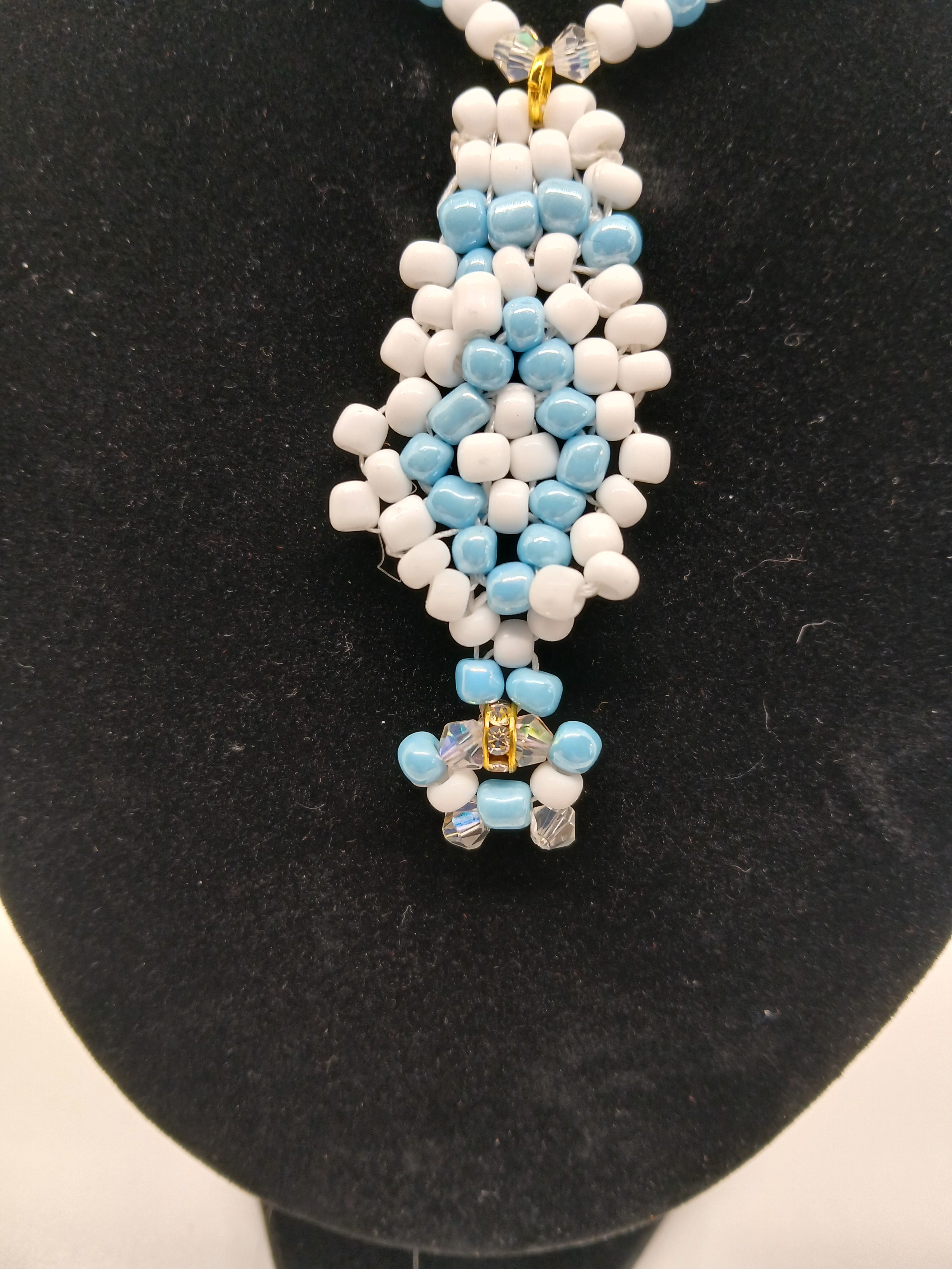 Light blue and white beaded pendant necklace with magnetic clasp  by Oma Regina