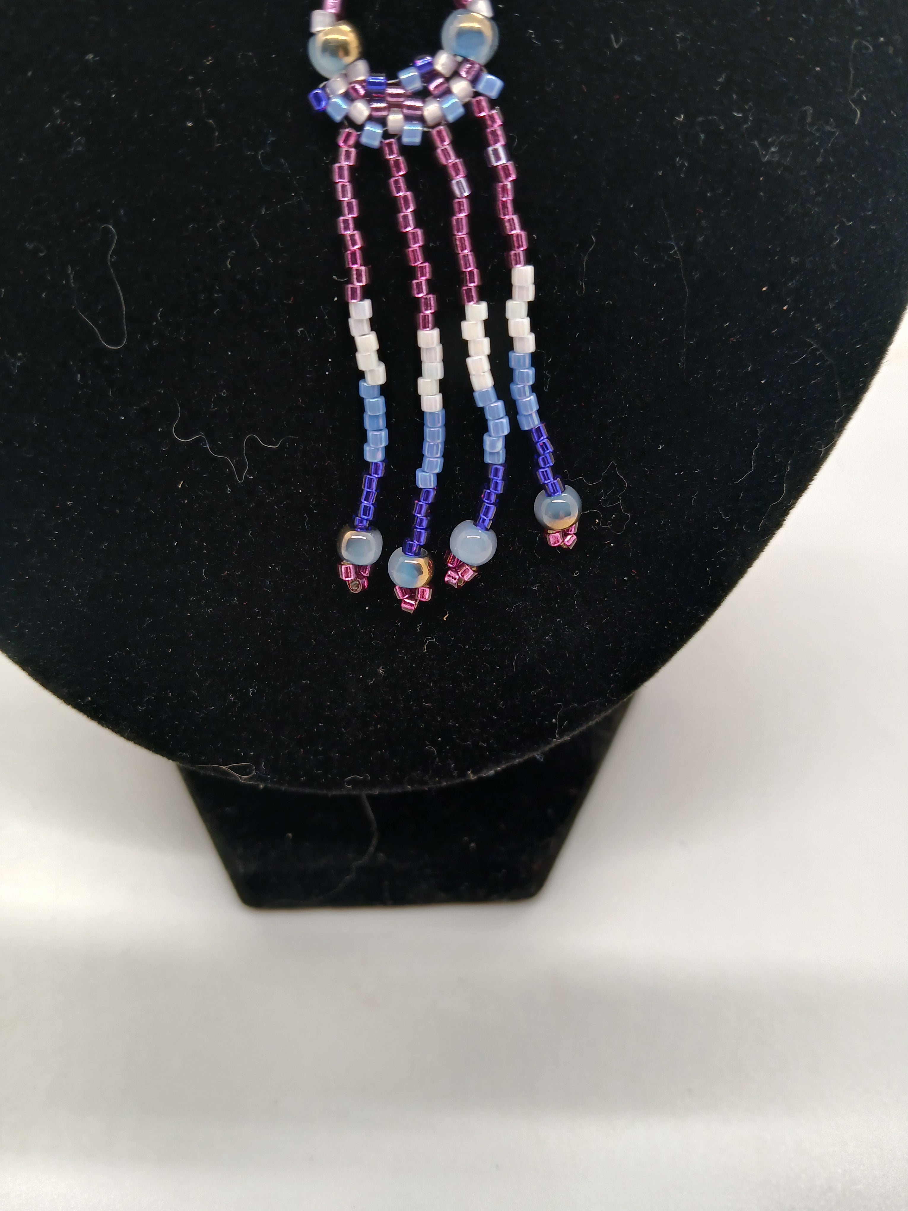 Set of two beaded pendants