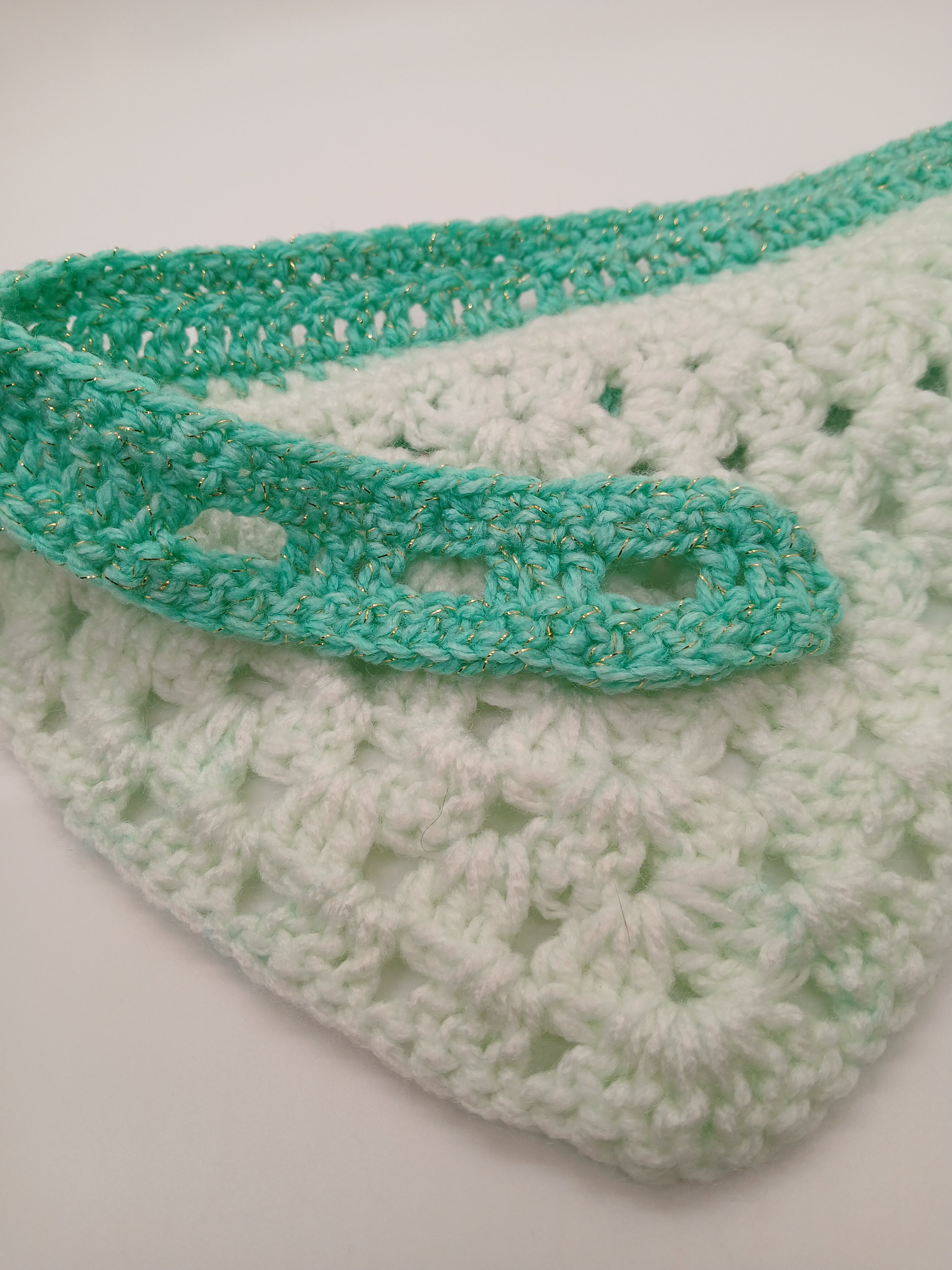 Adjustable crochet dog bandana with button closure in green hues