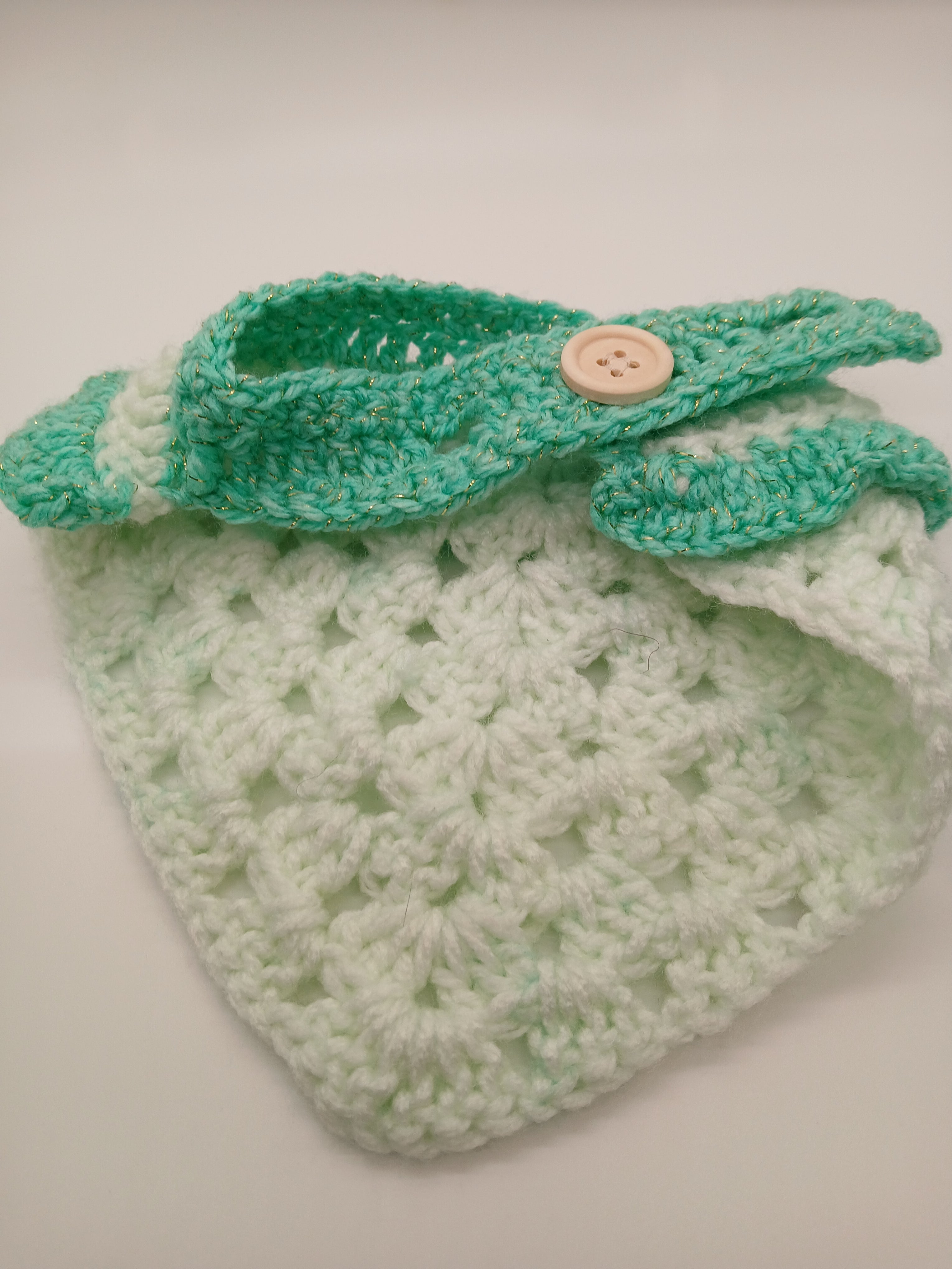 Adjustable crochet dog bandana with button closure in green hues